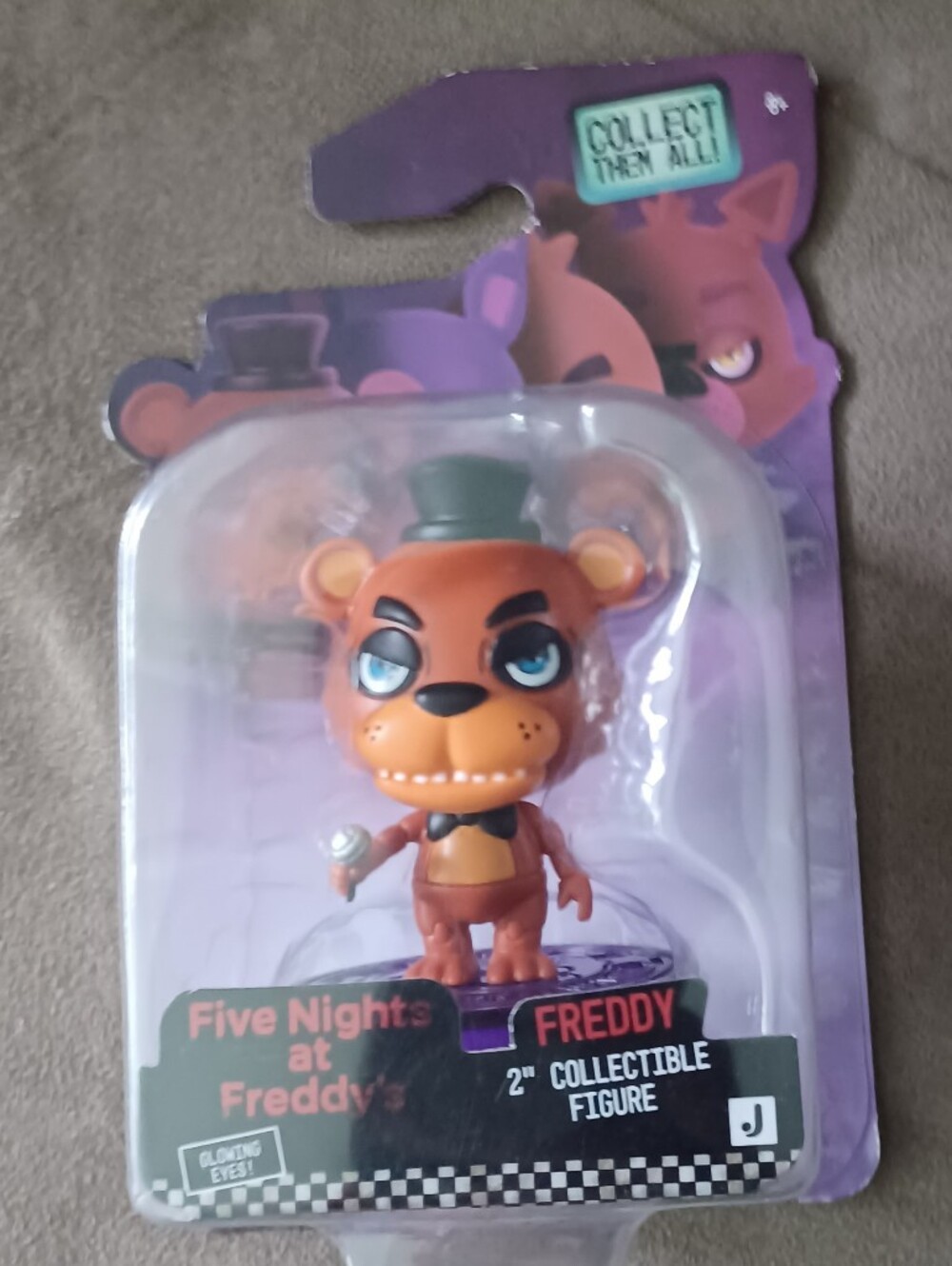 Freddy 2-inch Orange Collectible Figure with Green Hat